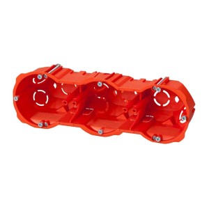 Pomarańczowa, potrójna puszka podtynkowa do instalacji elektrycznych.