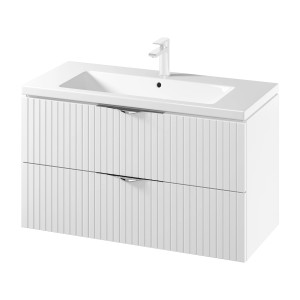 Biały zestaw mebli łazienkowych t.b.t. z umywalką i dwiema szufladami.