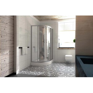 Kabina półokrągła t.b.t. w łazience z szarymi płytkami.