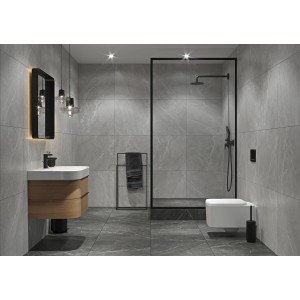 Nowoczesna łazienka z szarymi płytkami podłogowymi t.b.t., umywalką, prysznicem i WC.