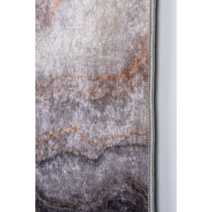 Zbliżenie dywanu z krótkim włosiem z abstrakcyjnym marmurkowym wzorem w odcieniach szarości i brązu.