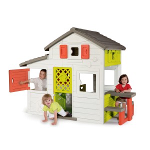 Kolorowy domek do zabawy t.b.t. dla dzieci ze stołem i ławkami.