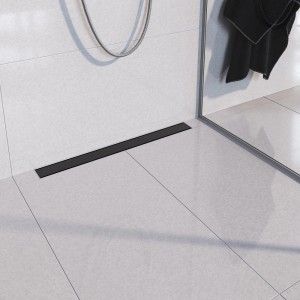 Czarny odpływ liniowy t.b.t. w nowoczesnej łazience z białymi płytkami.