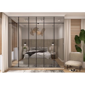 Nowoczesna szafa t.b.t. z czarnymi ramami przed sypialnią.