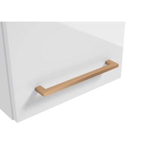 Złoty, prosty uchwyt meblowy na białej szufladzie. Idealny do nowoczesnych mebli.