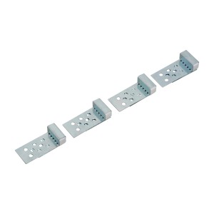 Cztery uchwyty do płytek LUX z magnesami do mocowania ram rewizyjnych.