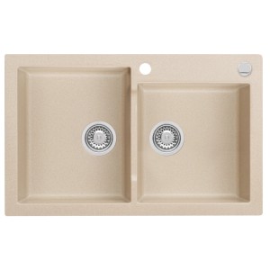 Beżowy zlewozmywak granitowy t.b.t. z dwiema komorami i armaturą odpływową.