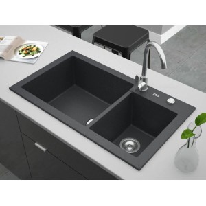 Czarny zlewozmywak granitowy t.b.t. z dwoma komorami i baterią na blacie kuchennym.