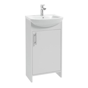 Biała umywalka t.b.t. z szafką, część zestawu mebli łazienkowych.