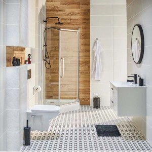 Nowoczesna łazienka z płytkami podłogowymi t.b.t. w czarno-biały wzór.