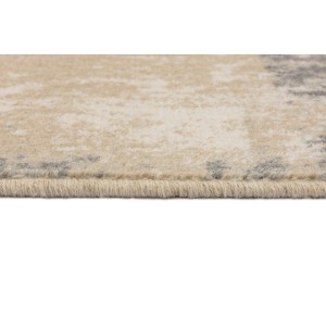 Zbliżenie dywanu z krótkim włosiem w kolorze beżowym i szarym.