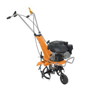 Pomarańczowy glebogryzark spalinowy t.b.t. do uprawy gleby w ogrodzie.