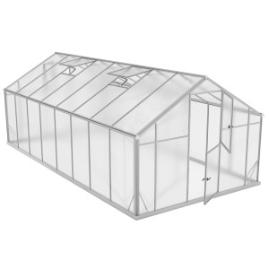 Jasna konstrukcja szklarni z otwartymi oknami i drzwiami.