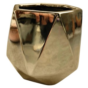Złota, geometryczna osłonka na doniczkę do roślin domowych.