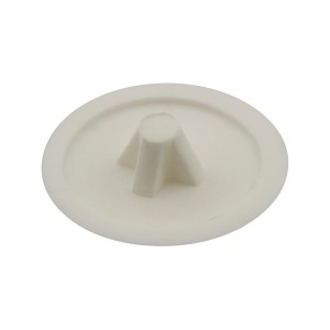 Biała zaślepka do śrub meblowych.