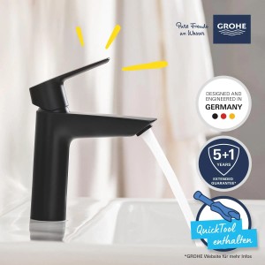 Czarna bateria umywalkowa Grohe QuickFix Start M ze strumieniem wody i QuickTool.