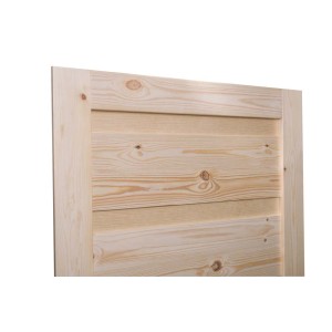 Drewniane drzwi wewnętrzne, nieobrobione, zbliżenie na słoje drewna.