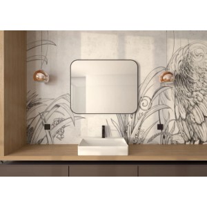 Prostokątne lustro t.b.t. z zaokrąglonymi rogami nad umywalką.