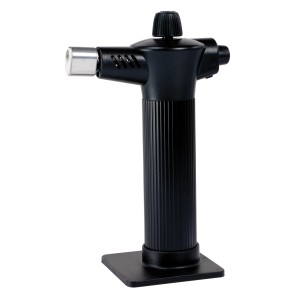 Czarny palnik t.b.t. ze stojakiem do lutowania.