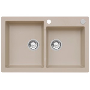 Beżowy zlewozmywak granitowy t.b.t. z dwiema komorami i armaturą odpływową.