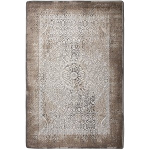 Wzorzysty dywan t.b.t. z długim włosiem w kolorze beżowym i białym.