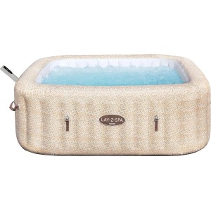 Nadmuchiwana wanna z hydromasażem o beżowym wzorze i niebieskiej wodzie.