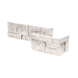 Zbliżenie na białe kamienie dekoracyjne i klinkier t.b.t.