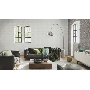 Salon z szarą tapetą dekoracyjną t.b.t. na ścianie.