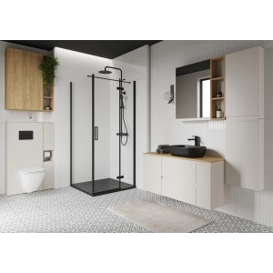 Nowoczesny zestaw mebli łazienkowych z prysznicem, umywalką, szafką z lustrem i WC.