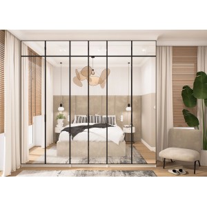 Nowoczesna szafa t.b.t. z szklanym frontem i czarną ramą w sypialni.