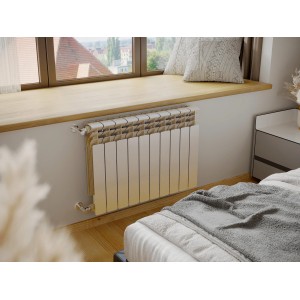 Grzejnik t.b.t. w pokoju, białe wykończenie.