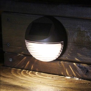 Okrągła solarna lampa ścienna do użytku zewnętrznego. Oświetlenie dekoracyjne do ogrodu i na patio.