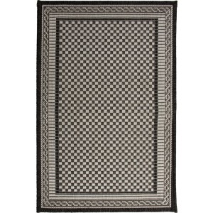 Dywan z krótkim włosiem t.b.t. z wzorem szachownicy w kolorze czarnym i beżowym.