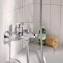 Błyszcząca bateria wannowa Grohe Swift, chrom, montaż ścienny. Bateria wannowa z wężem prysznicowym.