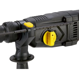 Zbliżenie czarnego młota udarowego t.b.t. z żółtymi elementami sterującymi.