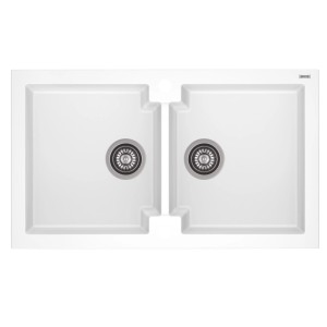 Biały zlewozmywak granitowy t.b.t. z dwiema komorami i odpływami.