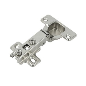 Zbliżenie srebrnego zawiasu meblowego.