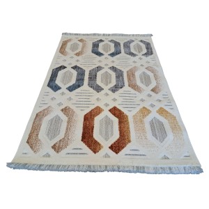 t.b.t. Dywan z krótkim włosiem o geometrycznym wzorze w kolorze beżowym, brązowym i niebieskim.