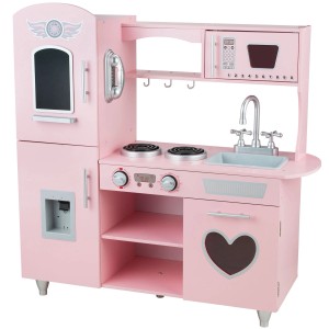 Różowa drewniana kuchnia dla dzieci z kuchenką, zlewem, mikrofalówką i lodówką.