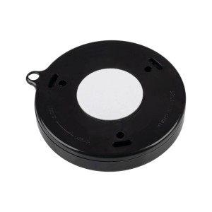 Czarna lampa podszafkowa t.b.t., okrągły kształt z białą naklejką pośrodku.