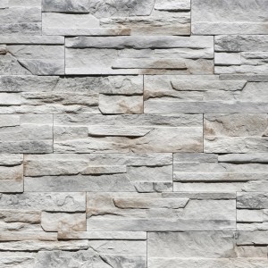 Ściana z szarych kamieni dekoracyjnych t.b.t. o wyglądzie kamienia.