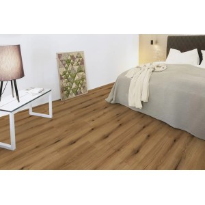 Ułożone jasnobrązowe panele podłogowe "t.b.t." w sypialni.