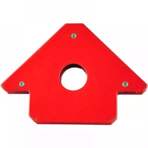 Czerwony kątownik spawalniczy t.b.t. z otworem pośrodku, akcesorium spawalnicze.
