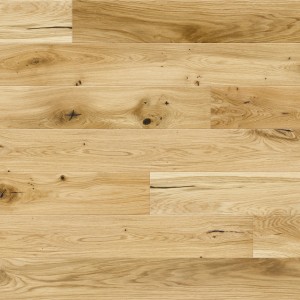 Jasne deski podłogowe t.b.t. z naturalnym rysunkiem drewna.