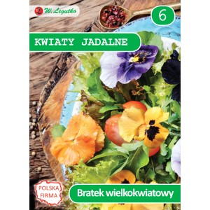 Opakowanie nasion kwiatów jadalnych (t.b.t.) z kolorowymi kwiatami na grządce sałatkowej.