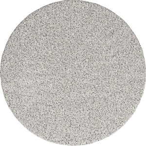 Okrągła, jasna płyta tarasowa/chodnikowa o drobnej, nakrapianej powierzchni.