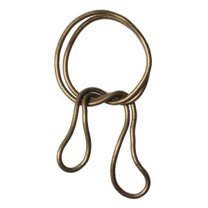 Dekoracyjny, złoty karnisz/szyna, skręcony i zawiązany.