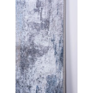 Zbliżenie szarego dywanu z krótkim włosiem i abstrakcyjnym wzorem.