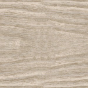 Zbliżenie jasnej listwy przypodłogowej z usłojeniem drewna.