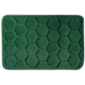 Zielony dywanik łazienkowy z sześciokątnym wzorem.